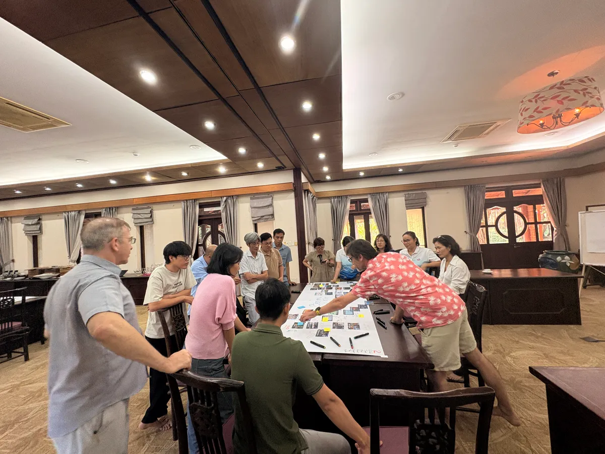 Participants collaborating on climate cause-and-effect cards