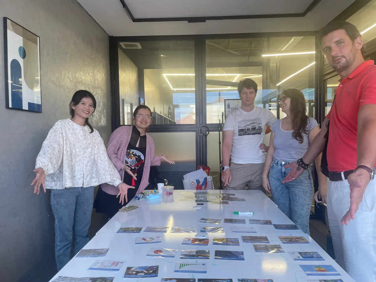 Participants posing with their digital collage work